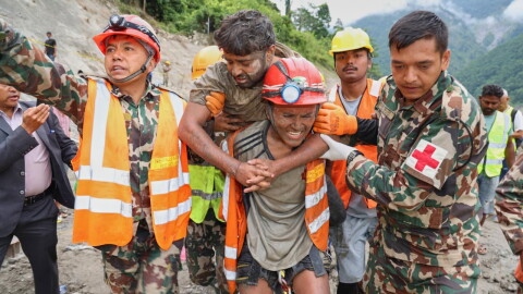 In this photo provided by the Nepal Army, soldiers rescue a worker alive from a tunnel during an ongoing operation at the Trishuli-3A hydropower project in Nepal's Rasuwa district, Friday, Sept. 4, 2026.