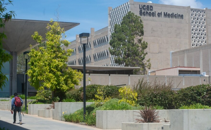 A student walks to the library at the UCSD School of Medicine on May 1, 2019. 