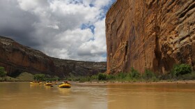 Rafters float past Steamboat Rock at the confluence of the Yampa and Green Rivers in Dinosaur National Monument in this undated photo. 