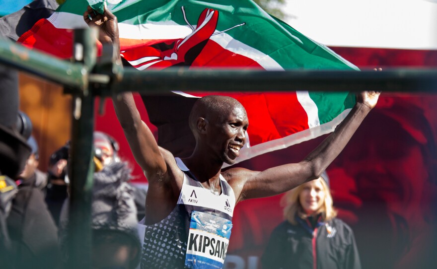 Wilson Kipsang of Kenya hoisted his country's flag after winning the New York City Marathon on Sunday. Kipsang won in an unofficial time of 2 hours, 10 minutes, 59 seconds.