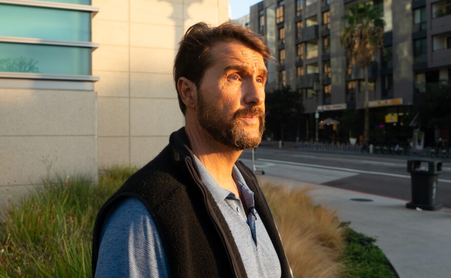 Former Navy SEAL John Surmont walks around Good Samaritan Hospital in Los Angeles looking for a tree he hid out in for a night in 2017 during a psychotic break, Nov. 6, 2019.