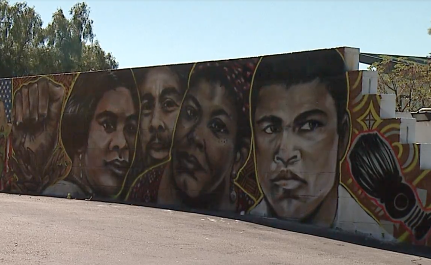 A mural at Gentry's Beauty & Barbershop Headquarters on Imperial Avenue in San Diego features leaders including Muhammad Ali and Maya Angelou. 

