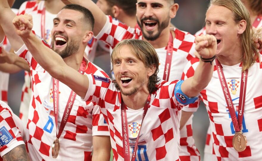 Croatia's Luka Modrić celebrates with his teammates after the team' secured a third-place finish in the 2022 World Cup play-off match with Morocco on Saturday, on Dec. 17, at Khalifa International Stadium in Doha, Qatar.
