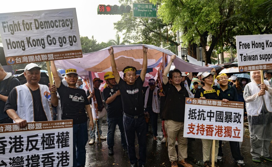 Members of the pro-Taiwan independence Taiwan Solidarity Union march in downtown Taipei in support of Hong Kong protesters demanding more freedom and autonomy from China.