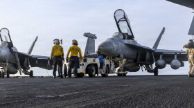 U.S. Sailors tow an EA-18G Growler, assigned to Electronic Attack Squadron (VAQ) 133, on the flight deck of Nimitz-class aircraft carrier USS Abraham Lincoln (CVN 72), July 30, 2026.
