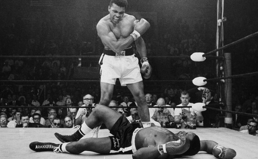 Heavyweight champion Muhammad Ali stands over fallen challenger Sonny Liston on May 25, 1965, in Lewiston, Maine. The bout lasted only one minute into the first round. Ali is the only man ever to win the World Heavyweight Boxing Championship three times.