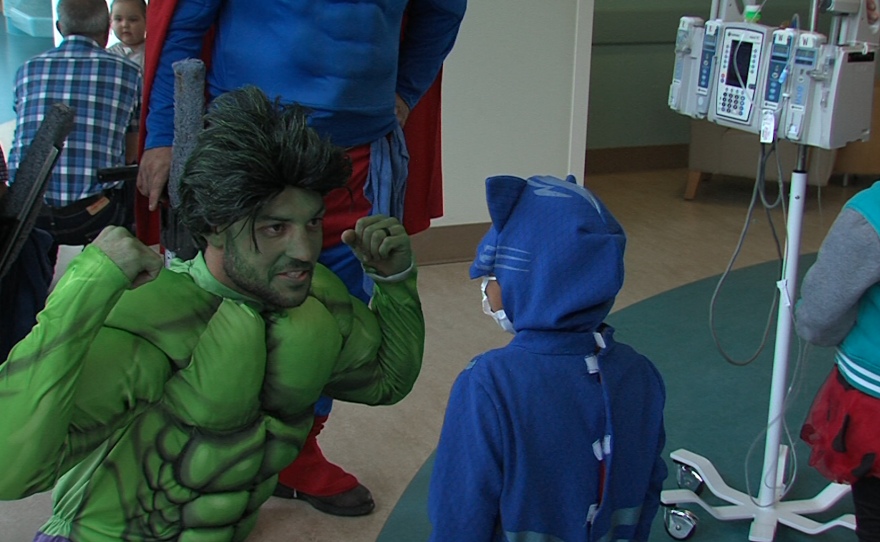 A superhero window washer dressed as the Hulk at Rady Children's Hospital, October 31, 2017.