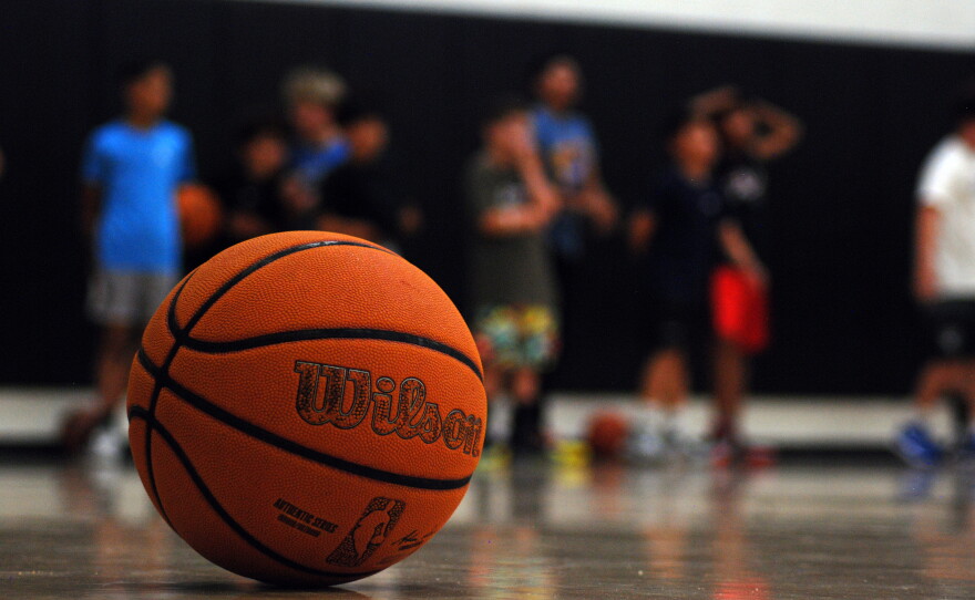San Marcos Basketball boys' club team listening to their coach during practice at San Elijo Middle School, May 5, 2026.