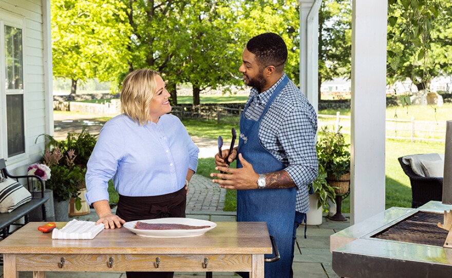 Test cook Lawman Johnson (right) makes host Julia Collin Davison (left) foolproof Grilled Flank Steak with Basil Dressing.