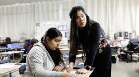 Mary Acebu, a special education teacher at Riverview Middle School in Bay Point, Calif., works with a student during a math lesson. She says using AI to help with the paperwork part of her job allows her to spend more time interacting with her students in a meaningful way.