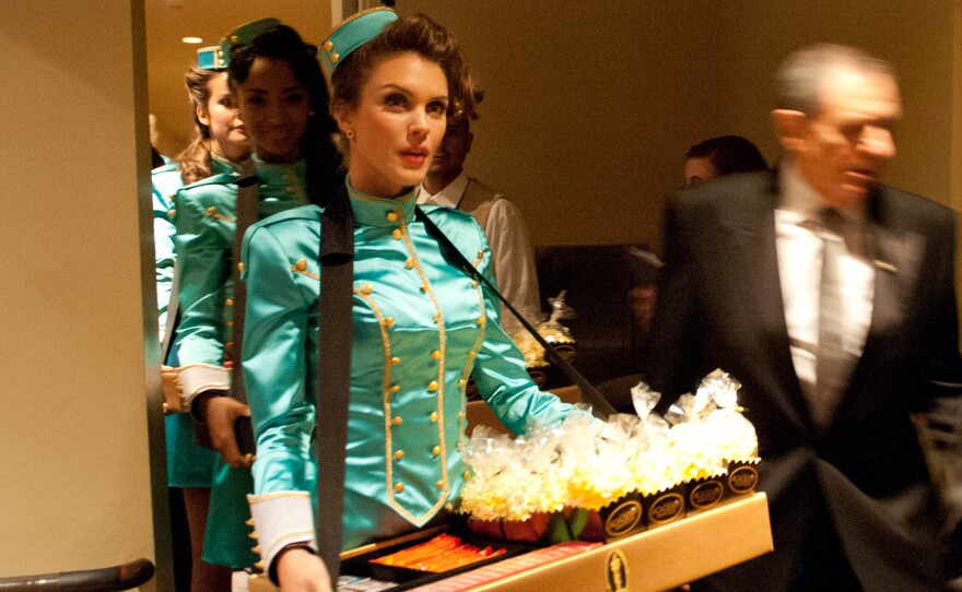 I have no clue what these "cigarette" girls were doing during the commercial break.