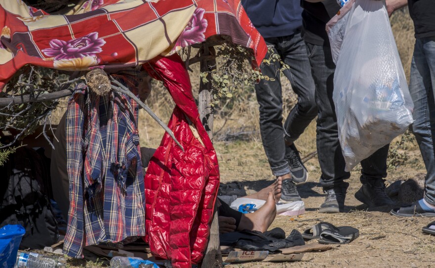 Migrants wait in the desert near Jacumba Hot Springs for immigration processing, October 6, 2023.