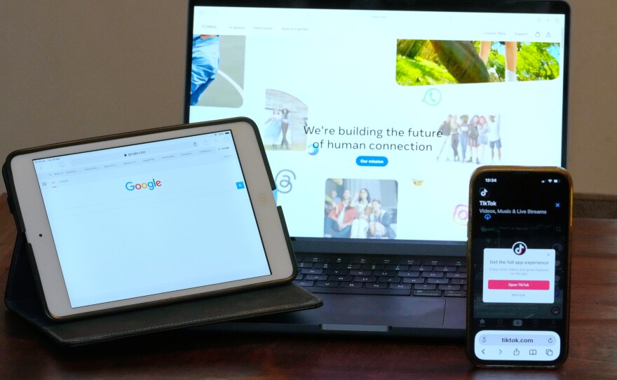 The home pages of Meta, Google and TikTok are displayed on devices in Sydney, Tuesday, April 28, 2026.