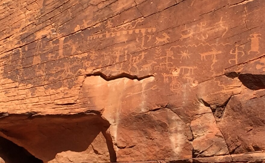 Gold Butte's red rock cliffs and slot canyons are home to many ancient petroglyphs. Some, like this one, have been shot at and damaged since federal land managers left the area due to safety concerns.