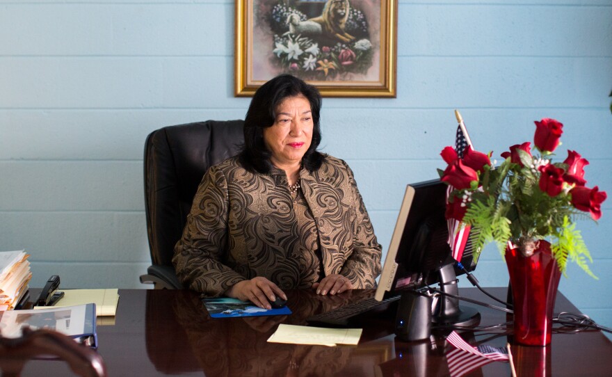 Maudia Melendez, minister at Jesus Ministry Inc., sits at her desk inside Statesville Road Baptist Church in Charlotte, N.C.