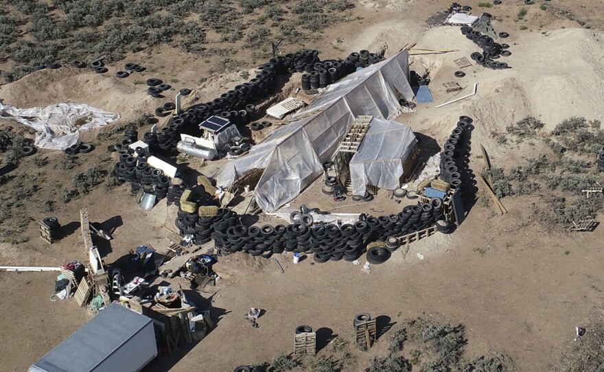 A ramshackle compound in the desert area of Amalia, N.M. Five former residents were indicted on terrorism and gun charges.