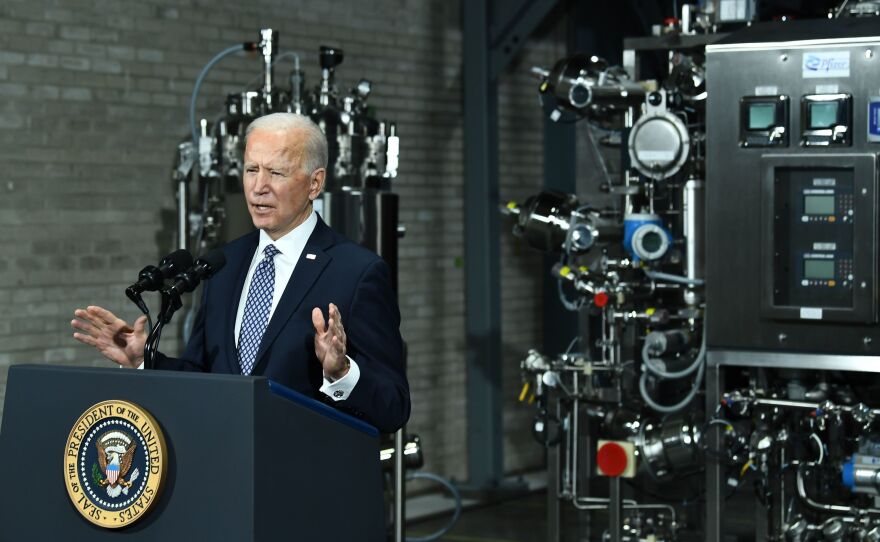 President Biden speaks Friday at a Pfizer COVID-19 vaccine manufacturing site in Portage, Mich. The House could pass a version of his $1.9 trillion COVID-19 relief legislation this week.