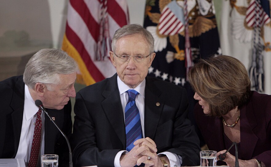 Senate Majority Leader Harry Reid (D-NV, center) listens as House Majority Leader Steny Hoyer (D-MD) and House Speaker Nancy Pelosi (D-CA) talk during a health care meeting last month. On Saturday, Reid presented a pledge from "more than 50" Democratic senators to his House counterparts that they will clear the House version for President Obama's signature.