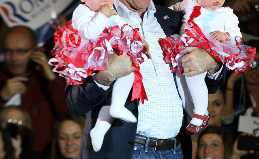 Mitt Romney holds babies during a campaign rally Sunday in Knoxville, Tenn. On Tuesday, Romney finished a distant second to Rick Santorum in the state.