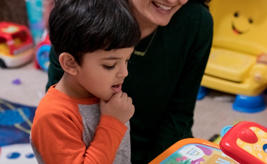 Mansi Bhatt plays with her son, Martand, at their home. When she took Martand to an emergency room in April with a burned hand, she left after waiting more than an hour for a surgeon to see him.
