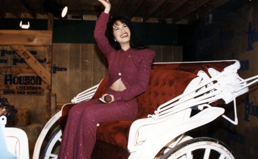 American singer Selena rides in a carriage during a performance at Houston's Astrodome on Feb. 26, 1995. The performance was her last before the 23-year-old's murder the following month.