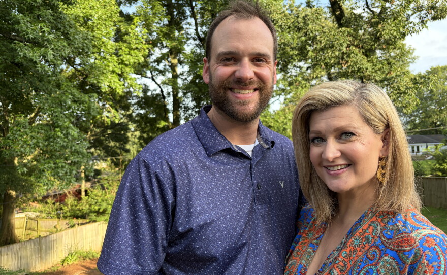 Meghan and Taylor Clopton stand in front of their backyard on June 17, 2026 in Vestavia Hills, Ala., where they hope to build their own pool one day.