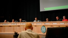 From left, Grossmont Union High School District governing board trustees Ava Hersch, Chris Fite, Scott Eckert, Robert Shield and Gary Woods listen to a speaker discuss the Christian nationalist activist Charlie Kirk during a meeting at Grossmont High School in El Cajon, California on Oct. 9, 2025.