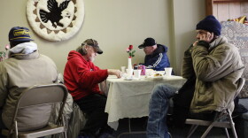 People eat a free community meal at The Center in Lima, Ohio, earlier this year. Although more than 46 million Americans are poor, the issue has gotten little attention in the presidential race.