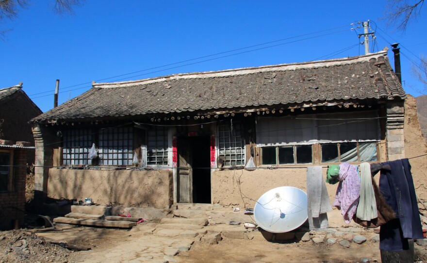 Ming lives in this mud brick home, three miles outside Beijing city limits.