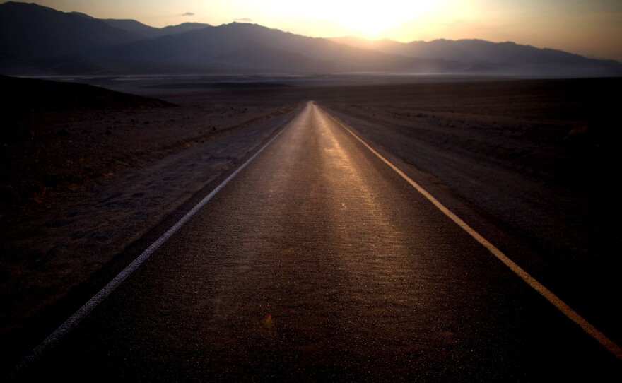 The sun sets on a record 129-degree day on Artists Drive near Furnace Creek.