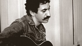 Jim Croce playing the guitar