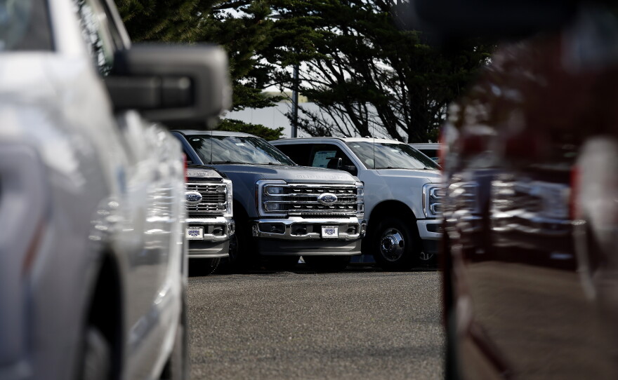 COLMA, CALIFORNIA - JANUARY 06:  Ford pickup trucks are displayed on the sales lot at Serramonte Ford on January 06, 2026 in Colma, California.