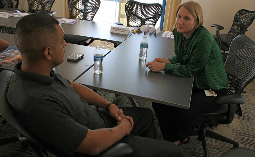 Volunteer listener Jennelise Hafen listens to military veteran Armando Telles in a one-on-one session at Oceanside Public Library, Oct. 2014.