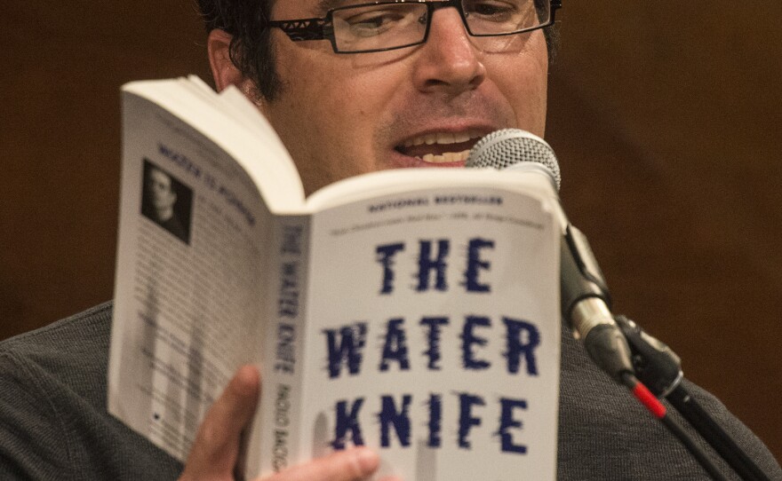 'Author, Paolo Bacigalupi reads a passage from his book, The Water Knife, at the live performance of Michel Martin's Going There at Colorado State University Tuesday May 24, 2016. The show was titled, " The Future of Water."'