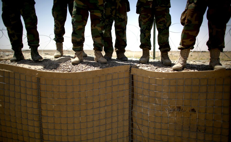 Afghan commandos train for a night raid on a Taliban-controlled village. They practice getting out of the helicopters efficiently and quickly. The elite unit is Afghanistan's most highly trained and effective fighting force.