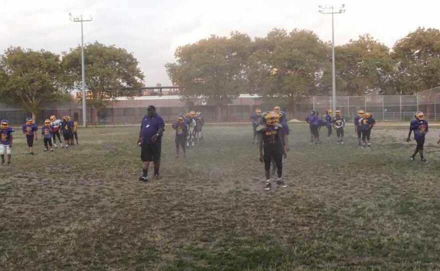 Boys on the Mo Better Jaguars youth football team line up for warm ups during practice in September 2014.