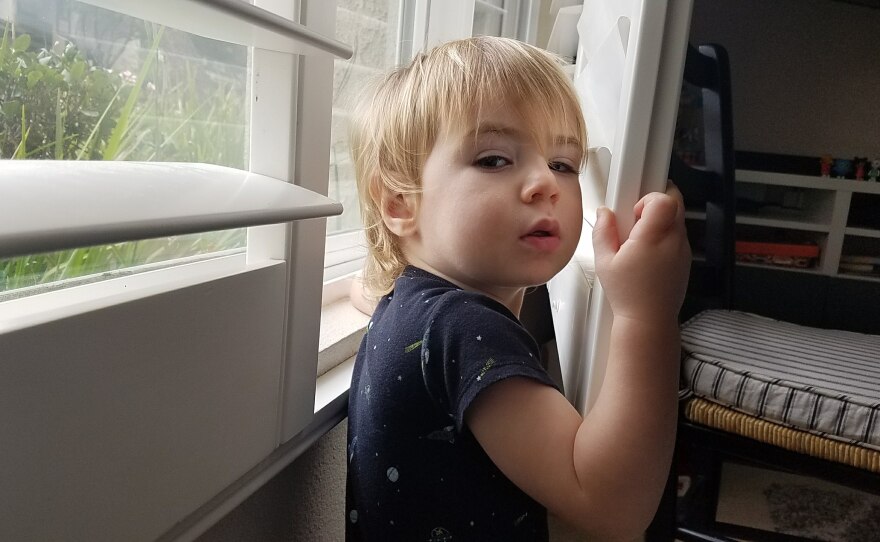 Owen Fitzpatrick plays with a window shutter in his Del mar home, Jan. 30, 2018.