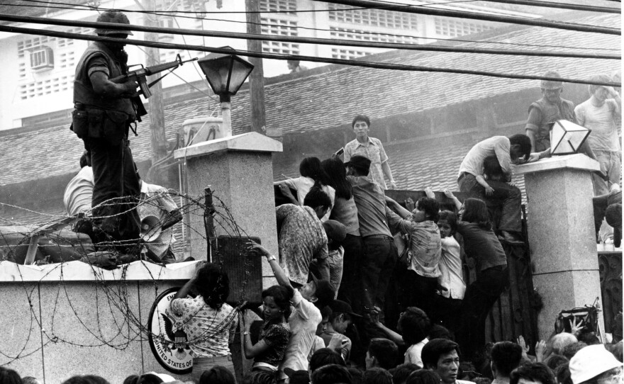 Crowds of people attempted to scale the wall of the U.S. Embassy in Saigon, Vietnam, on April 29, 1975, trying to get to the helicopter pickup zone just before the end of the Vietnam War.