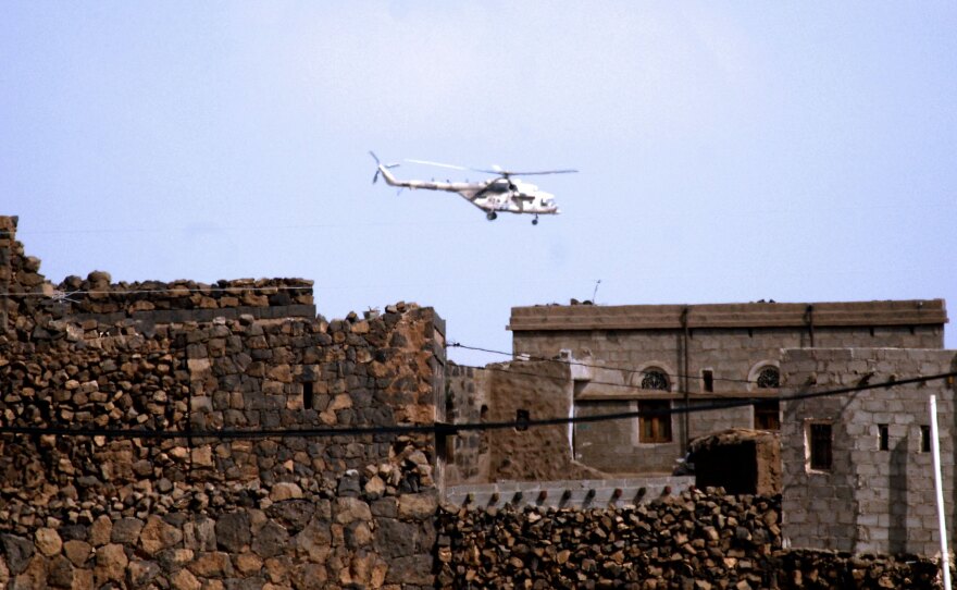 A Yemeni army helicopter flies over the district of Arhab in the Sanaa province after security forces carried out operations against al-Qaida suspects on Dec. 17.