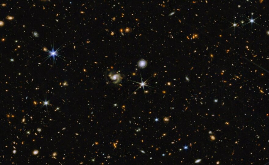 Hundreds of galaxies appear in this image, which combines near-infrared colors captured by Webb's telescope with those from Hubble.