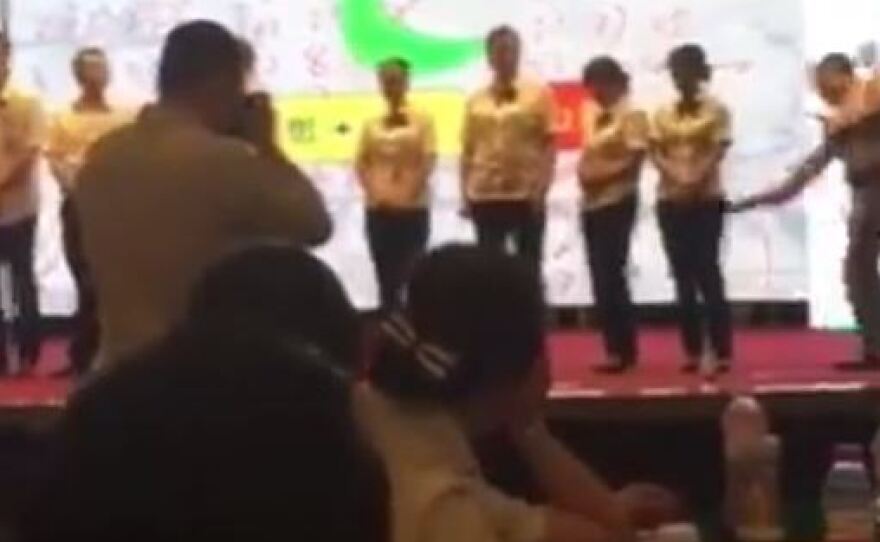 A video showing a public spanking of bank trainees quickly drew outrage in China after it was posted online.