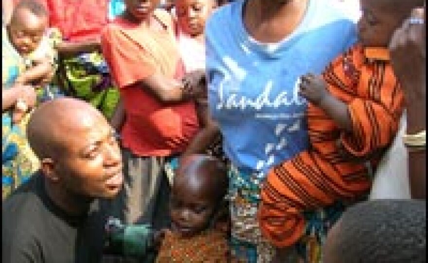 Dr. Isaac Mwinde Mongolari, the lone doctor at a remote hospital, examines a young patient in Chambucha. Some of his patients are dying of treatable conditions including malaria, dysentery and malnutrition.