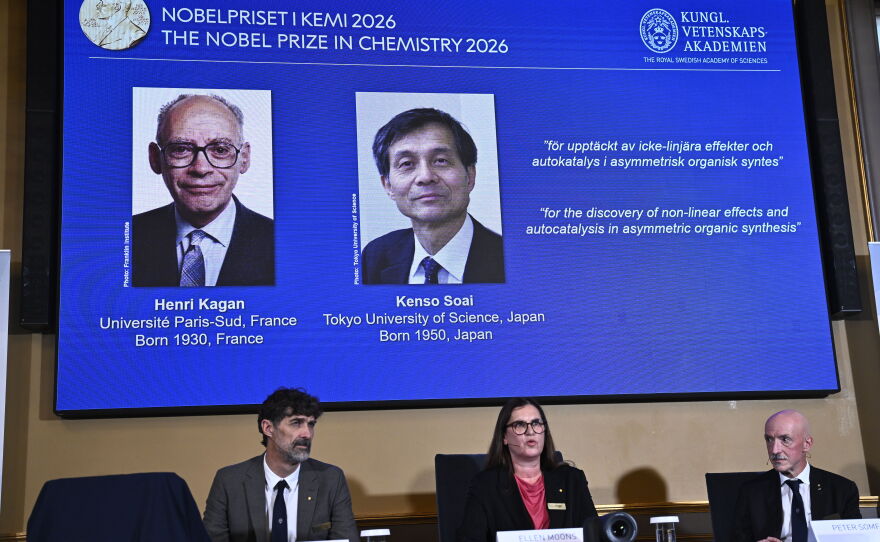 Portraits of Henri Kagan and Kenso Soai are shown on the screen as they are awarded the 2026 Nobel Prize in Chemistry, at the Royal Swedish Academy of Sciences in Stockholm, Sweden, on Oct. 7, 2026.