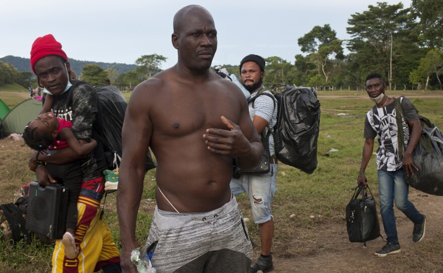 Gegrand Joseph (front), a Haitian who hiked across the Darién Gap five years ago, was deported by the Trump administration and is tackling this same patch of jungle a second time to get back to the U.S.