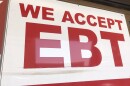 An sign displaying "We Accept EBT" is hung outside of a store in City Heights, in this undated photo.