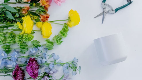 Flower Arranging 101 Workshop - Image of different color flowers on the left and pruning shears and a white vase on the right