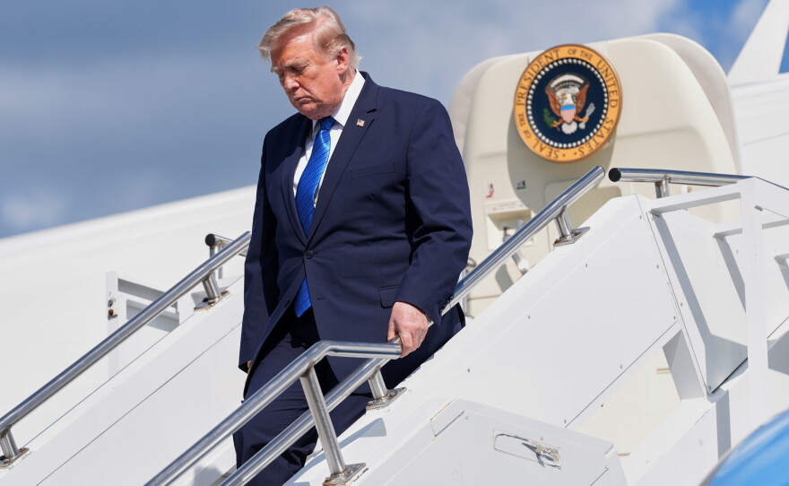 President Donald Trump exits Air Force One at Morristown Municipal Airport in Morristown, N.J., Friday, July 31, 2026, after a trip to Camp David, the presidential retreat.