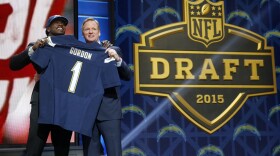 Wisconsin running back Melvin Gordon poses for photos with NFL commissioner Roger Goodell after being selected by the San Diego Chargers as the 15th pick in the first round of the 2015 NFL Draft in Chicago, April 30.