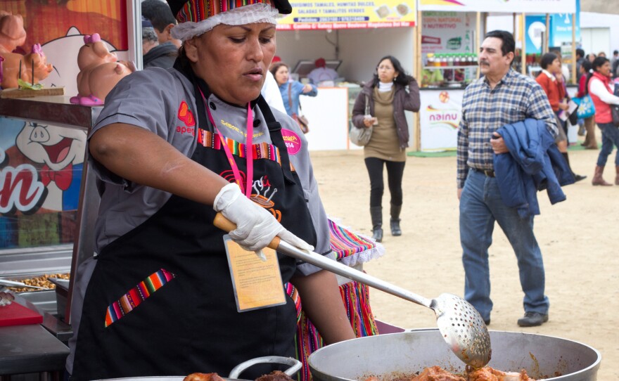 A vendor cooks a Peruvian stew at Mistura in Lima, the largest food festival in Latin America.