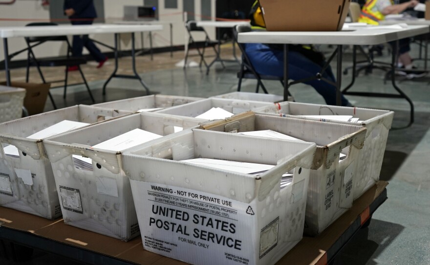 Workers prepare absentee ballots for mailing at the Wake County Board of Elections in Raleigh, N.C., Thursday, Sept. 3, 2020. Other states will soon follow North Carolina in sending out ballots to voters as a nearly two month-long general election voting season gets underway.